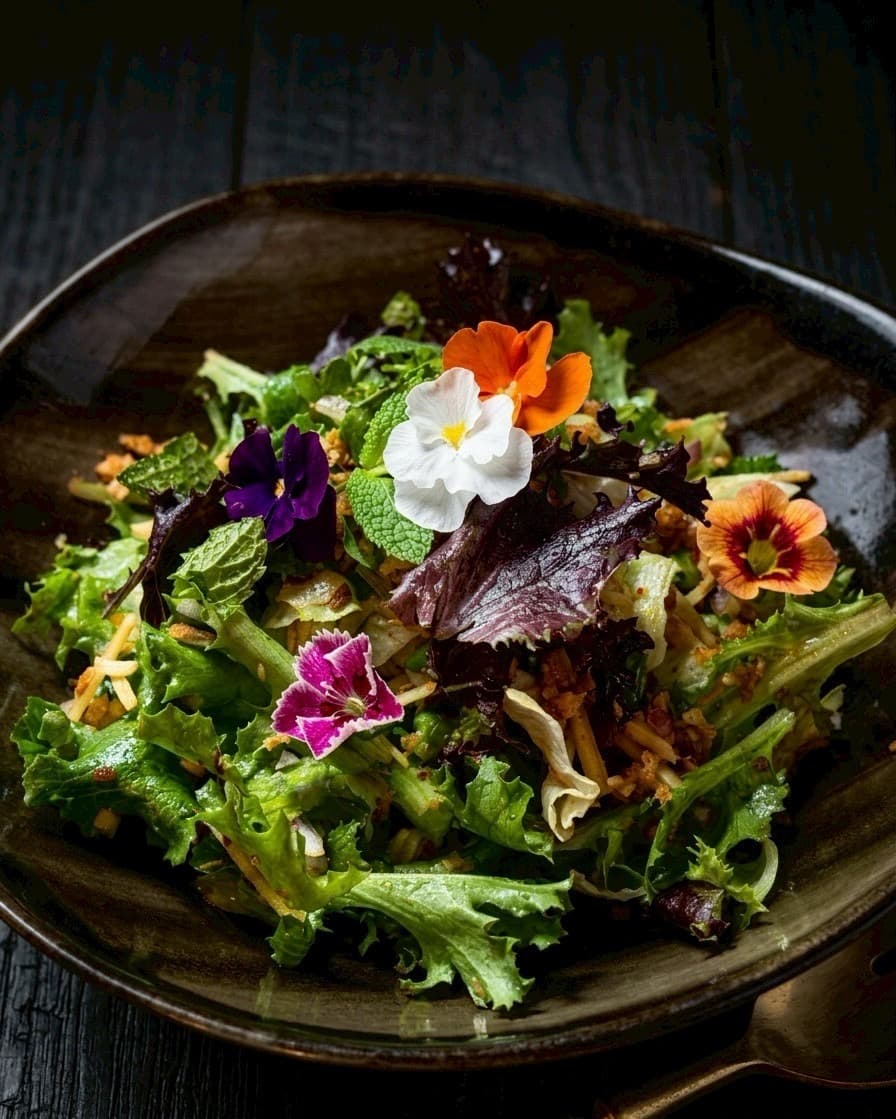 Garden salad with edible blossoms — Kruathai Atlanta