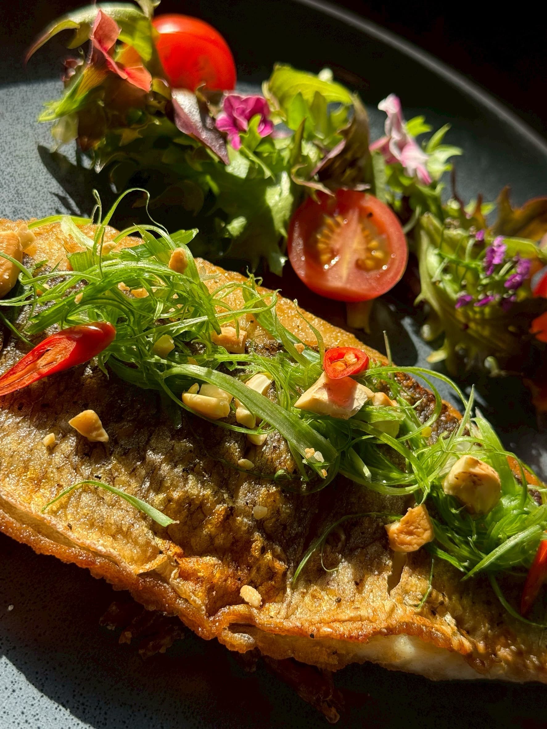Crispy pan-seared branzino fillet with cashew — Kruathai Atlanta
